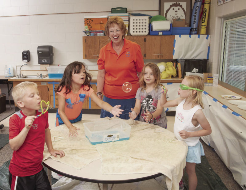 Pam Magdanz with students in a classroom