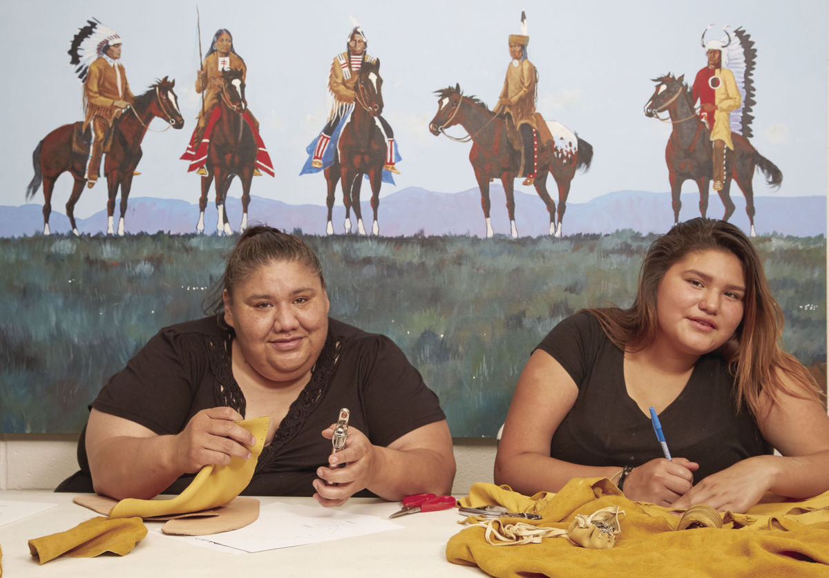 Karlyn Walker and her daughter making native crafts