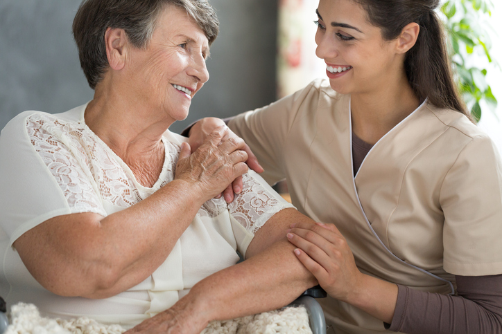 Elderly woman with nurse